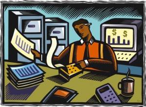 An accountant using an adding machine