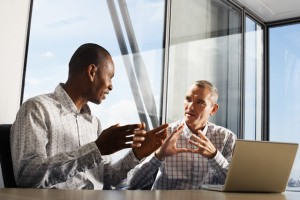 Two Businessmen Using Laptop