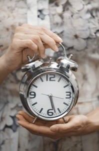 Woman with alarm clock