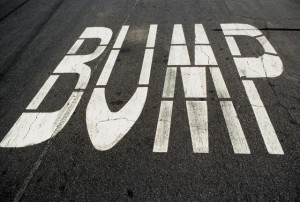 'Bump' written on a tarmac road