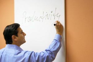 Businessman writing on a whiteboard